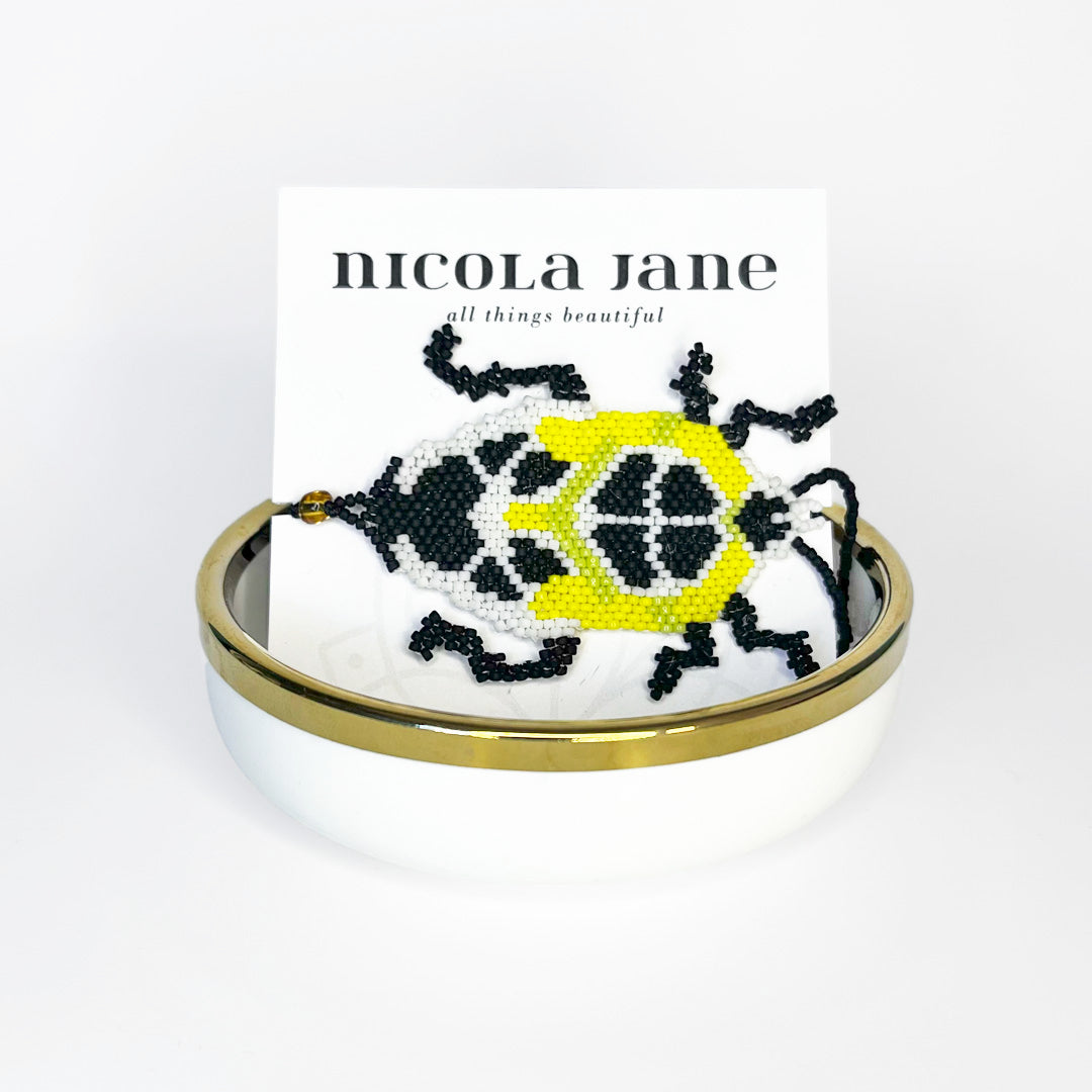 Beaded bracelet - black & yellow bug