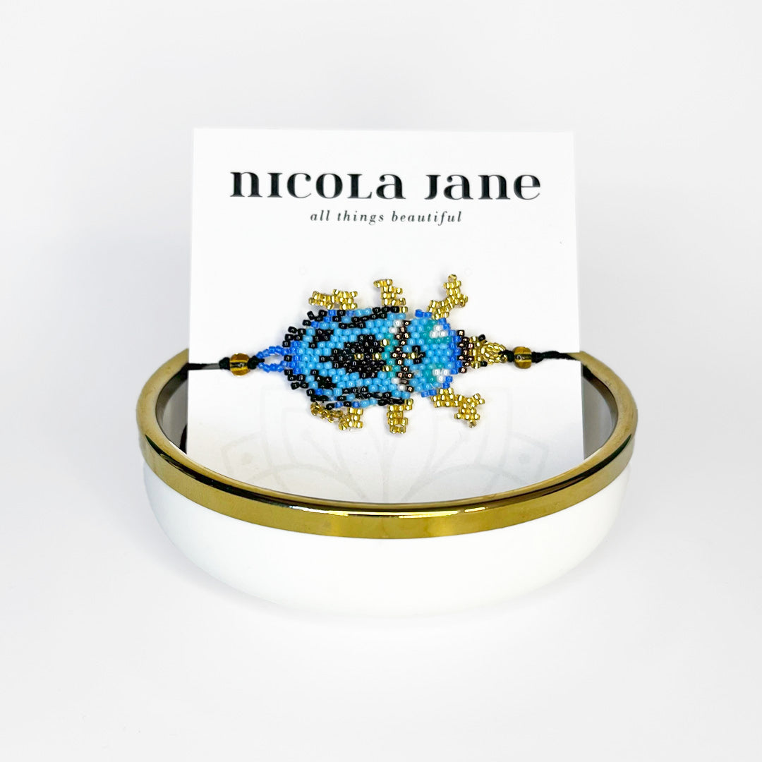 Beaded bracelet - blue & gold bug