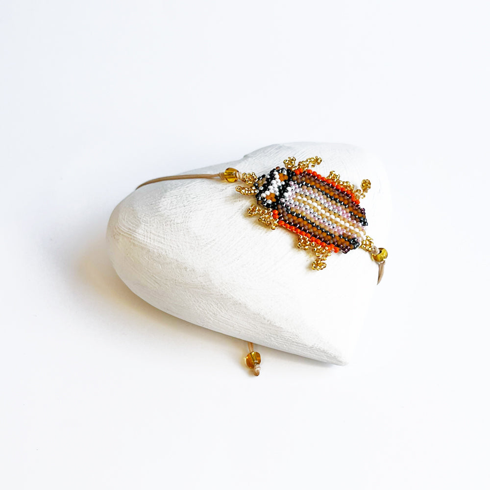 Gold and orange bug