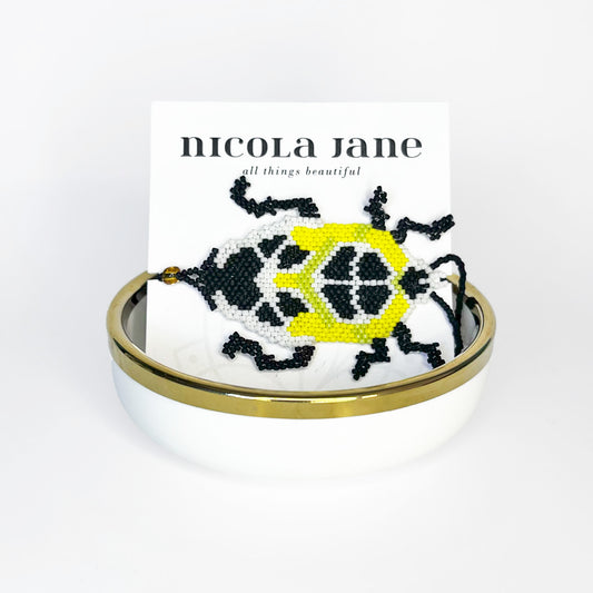 Beaded bracelet - black & yellow bug