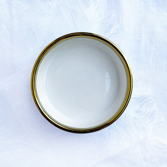 Small white ceramic bowls with a gold trim